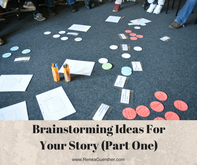Papers and notecards spread out on a carpet and organized into categories in a brainstorming session.